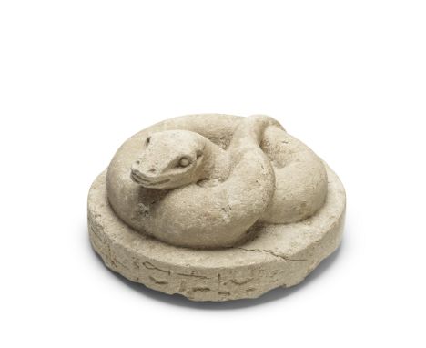  An Egyptian limestone snake Late First Intermediate Period - early Middle Kingdom, circa 2134-1640 B.C.The oval base with te