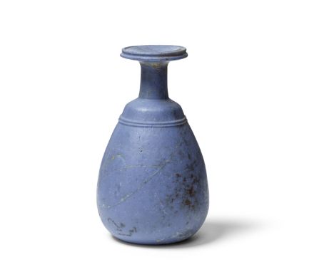  A Greek opaque pale blue glass bottle Late Hellenistic Period, circa 1st Century B.C.8.4cm highFootnotes:Provenance:Private 