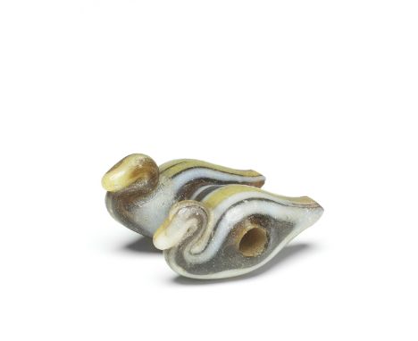  An Egyptian glass bead in the form of twin resting ducks New Kingdom, 18th Dynasty, circa 1550-1292 B.C.1.7cm wide, 1.9cm lo