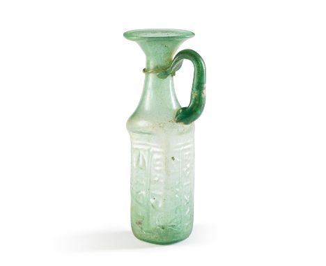  A Byzantine green glass mould-blown jug for St Sabas Circa 5th-7th Century A.D.19.1cm high Footnotes:Provenance:Stephen Shal