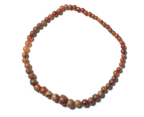  An Egyptian carnelian gradiated spherical bead necklace  New Kingdom, circa 1550-1069 B.C. and laterapprox 50cm longFootnote