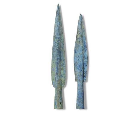  Two European bronze socketed spearheads Late Bronze Age, circa 13th-9th Century B.C.30cm and 27.3cm high  (2)Footnotes:Prove