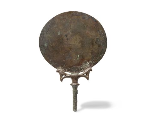  An Egyptian bronze mirror New Kingdom, 18th Dynasty, circa 1550-1292 B.C.18.5cm highFootnotes:Provenance:Mansoor Abd Essayid