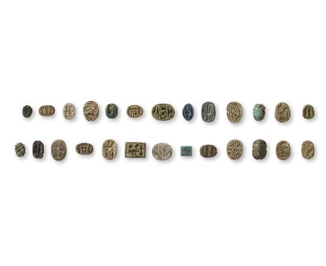  A group of Egyptian scarabs, cowroids and beads Middle Kingdom-Late Period, circa 2046-525 B.C.Comprising a glazed steatite 