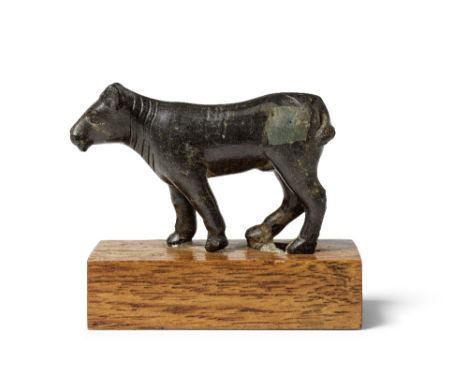  A Greek bronze figure of a bull Circa 5th-4th Century B.C.6cm longFootnotes:Provenance:with K. J. Hewett (1919-1994), London