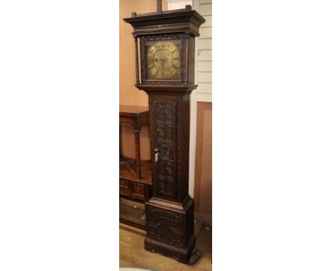 A George III carved oak thirty hour longcase clock H.220cm