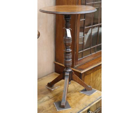 An Arts and Crafts walnut tripod table W.45cm