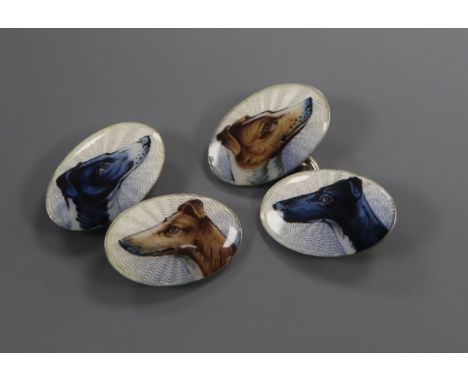 A pair of sterling and enamel oval cufflinks, decorated with the heads of greyhounds.