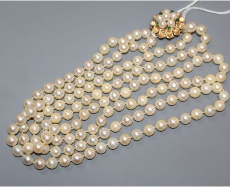 A cultured pearl double row necklace with gold, cultured pearl and emerald clasp, stamped 14k