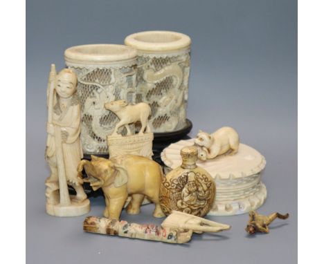 A Japanese carved ivory netsuke, a pair of pierced ivory vases, jar and cover, etc. (9)