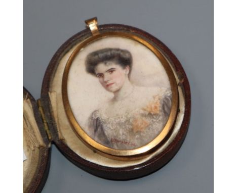 An Edwardian gilt framed oval oil on ivory miniature, portrait of a lady, cased