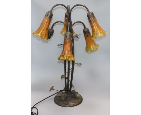 A Tiffany-style lamp lacking one shade