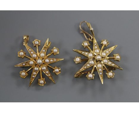 Two Edwardian 15ct gold and seed pearl set starburst pendant brooches, 26mm, gross 8.2 grams.
