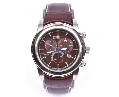 A Citizen Eco-Drive Chronograph Watch WR100 with quartz movement. Stainless steel case and a dark brown face with silvered nu