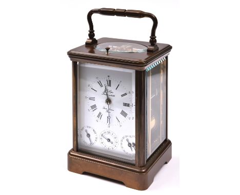 A modern L'Epee, France brass carriage clock. A repeater clock with three separate dials below main dial, showing day, alarm 