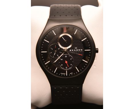 A Skagen 806XLTBLB Titanium watch with quartz movement. In black with three additional dials. With case and instructions. Wat