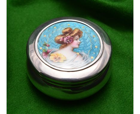 A silver round pot with removable lid and gilt washed interior. Engine turned enamel lid with a portrait of a lady with panse