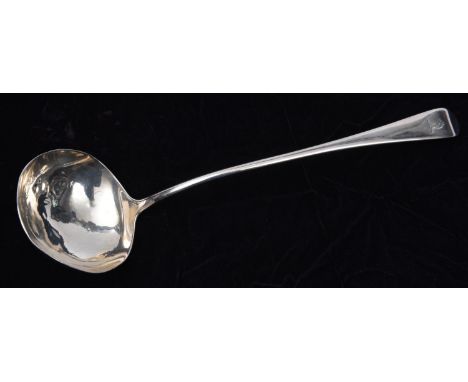 A large Georgian silver ladle with crest on the handle. Hallmarked London 1790, 'TW' possibly for Thomas Wallis II. 145g. GC-