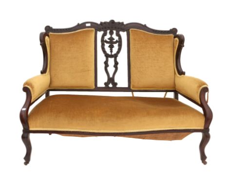 Late 19th century mahogany framed sofa, upholstered in gold fabric on carved supports 