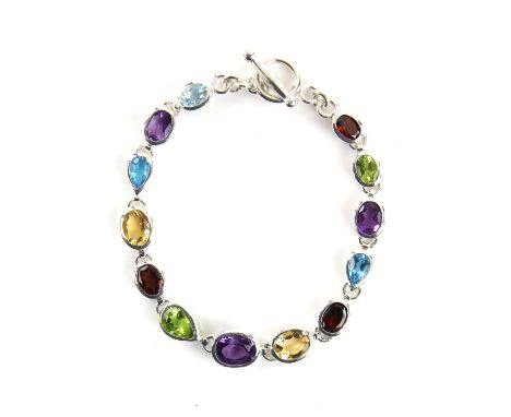Multi-gemstone set bracelet, set with amethyst, garnets, citrine, peridot and blue topaz, mounted in silver with a t-bar clas