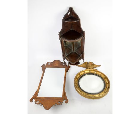 Yew wood veneered fret framed wall mirror, gilt convex mirror with eagle finial and a corner wall shelf with mirrored back, (