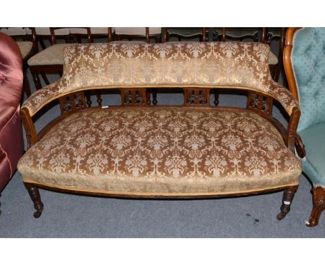 A small part upholstered two seater sofa, circa 1900