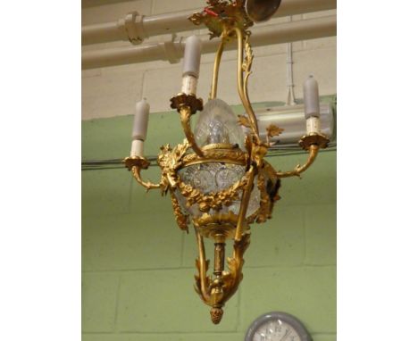 A gilt metal and cut glass hanging light fitting