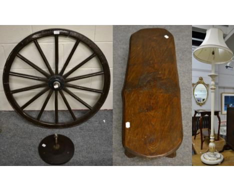 A wooden cart wheel with wall mount; an oak low table/stool and a white painted standard lamp (3)