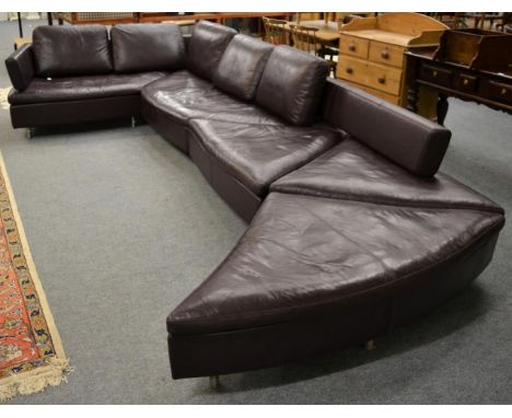 Ralph Benz: a burgundy leather modular corner sofa, modern, in five sections, with five removable back cushions against a pad