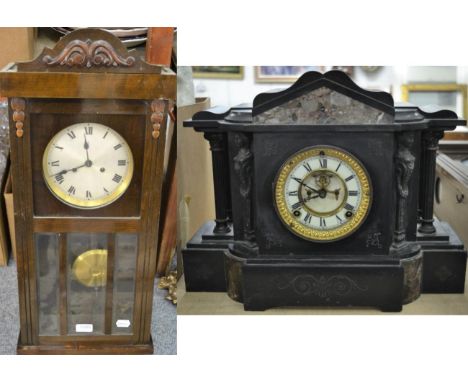 A late Victorian black slate mantel clock and a 1930s striking wall clock 