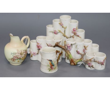 A Royal Worcester 'cluster' of vases, applied with blossoming hawthorn, 24cms, and two Royal Worcester jugs (3)ex Congelow Ho