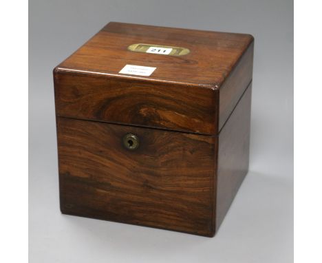 An early Victorian rosewood decanter box, of square section, with brass inset handle to the top, (lacking interior fittings)e