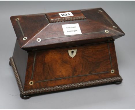 A William IV rosewood sarcophagus shaped tea caddy, with gadrooned borders inlaid with mother of pearl roundels width 25cmex 