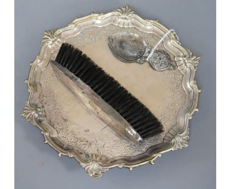 A silver Ionian caddy spoon, a silver backed brush and a waiter