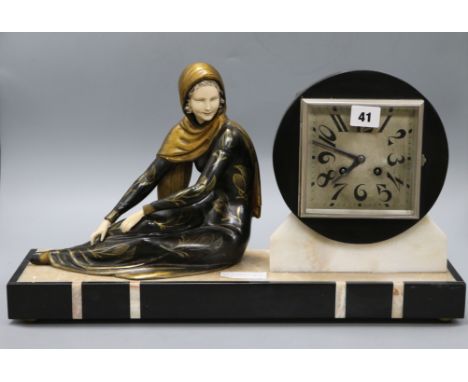 An Art Deco figural clock length 49.5cm