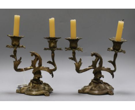 A pair of Louis XV design gilt metal two light candelabra, cast and chased with foliate, height 21cmex Congelow House