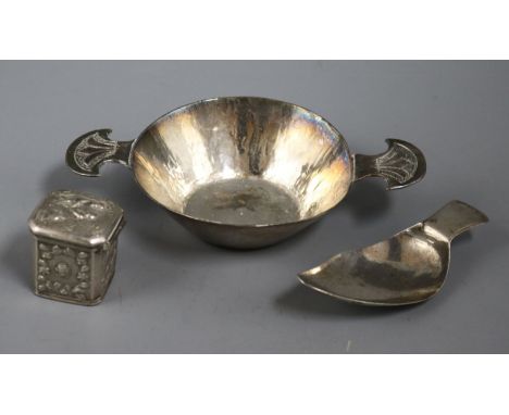 A George III silver caddy spoon, a continental pill box and a quaich.