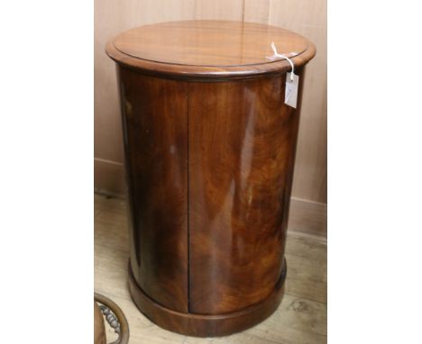 A mid 19th century mahogany cylindrical commode, with lifting top and two doors and covered section, height 74cmex Congelow H