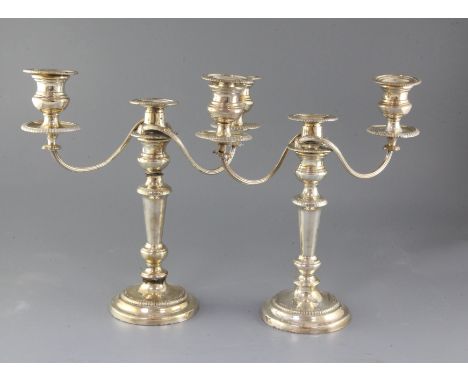 A pair of silver plated two branch three light candelabra, one (a.f), 35.2cm.