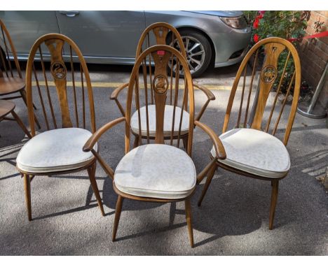 A set of 4 Ercol Windsor swan back dining chairs comprising 2 with armchairs and 2 standard 