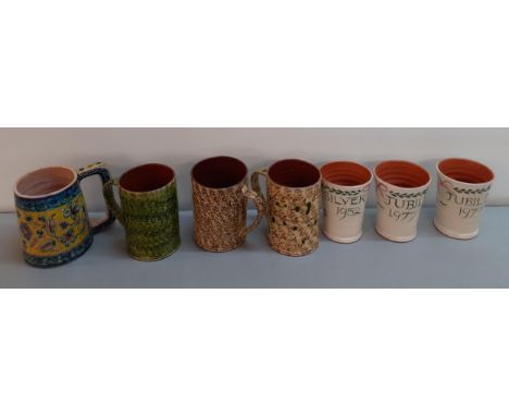 A group of glazed pottery mugs to include 3 commemorative mugs, 1952 and 1977, a Palestine mug, and 3 vintage mugs in the Mor