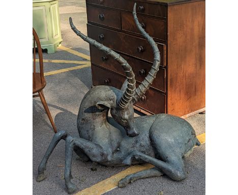A large cast model of an Impala sat head back, 108.5cm high at highest point Location: G 