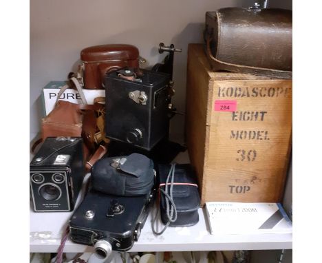 A vintage Kodascope Eight model 30 in original wooden box, together with vintage cameras and a Pure radio, boxedLocation: 11: