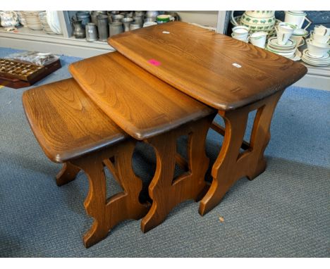 A nest of three Ercol dark elm stained tablesLocation: 