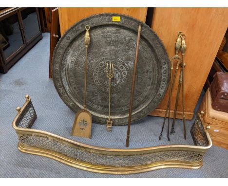 A mixed lot to include a Victorian brass fire fender, fireside implements and a Middle Eastern tray, a Johnny Brooks, Tottenh