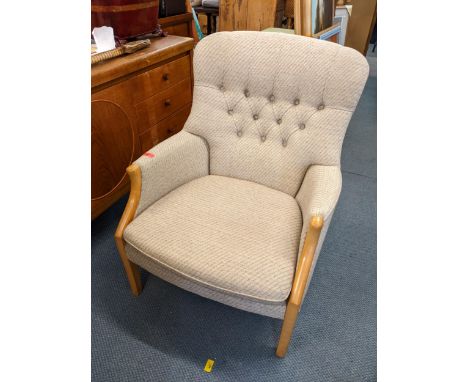 A Parker Knoll armchair with button back upholstery and a beech frame Location 