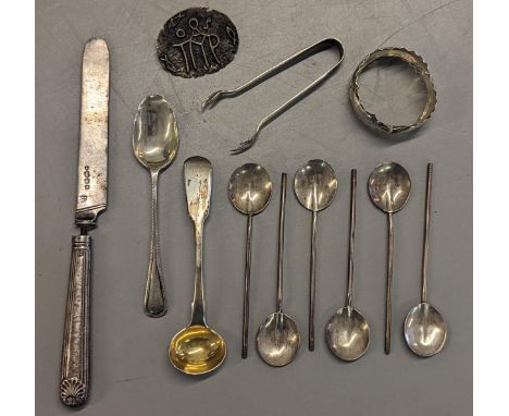 A mixed lot of silver items to include coffee bean spoons, tongs, napkin ring A/F, knife and other spoons, total weight 103.4