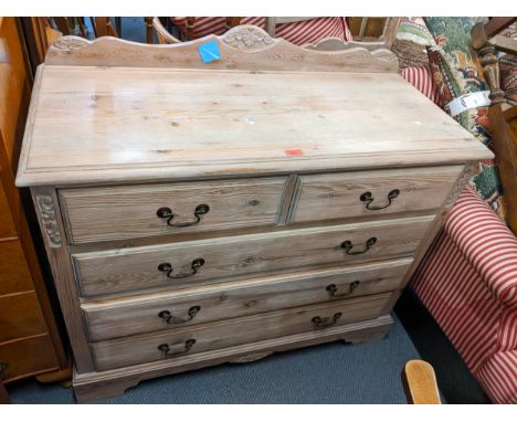 A modern pine chest having a raised back, two short and three long drawers, 94cm h x 104cm w, together with a ladder back arm