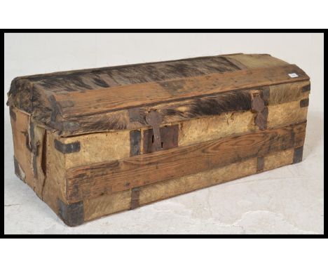 A 19th Century Boar / Pig skin iron bound steamer travel trunk, dome top with iron strap-work ( remnants of hair ), iron clas