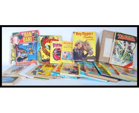 A collection of 20th Century books, annuals, comics to include, Biggles, Rupert, Dan Dare, Tarzan, Star Trek, Noddy by Enid B